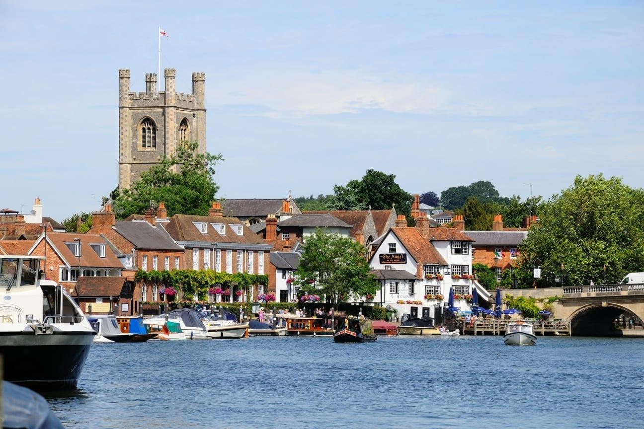 The Henley-on-Thames riverfront, with St Mary’s church tower, moored boats and Henley Bridge